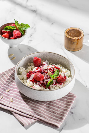 cottage cheese with raspberries and almond petals. High quality photoの写真素材