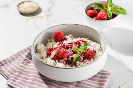 cottage cheese with raspberries and almond petals. High quality photoの写真素材