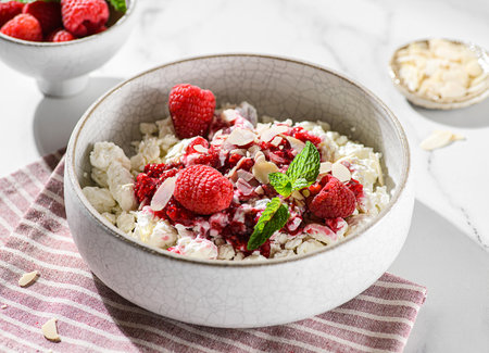 cottage cheese with raspberries and almond petals. High quality photoの写真素材