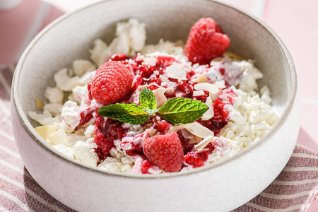 cottage cheese with raspberries and almond petals. High quality photoの写真素材