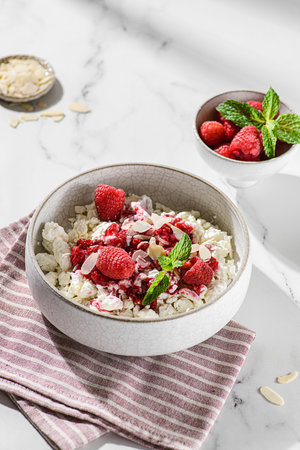cottage cheese with raspberries and almond petals. High quality photoの写真素材