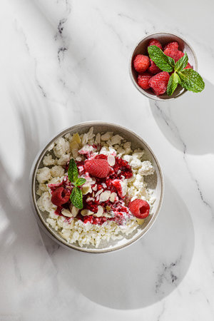 cottage cheese with raspberries and almond petals. High quality photoの写真素材
