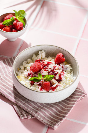 cottage cheese with raspberries and almond petals. High quality photoの写真素材