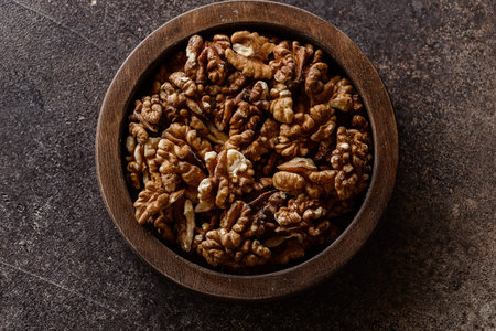 organic raw walnuts in a wooden bowl superfood, vegetarian. High quality photoの写真素材