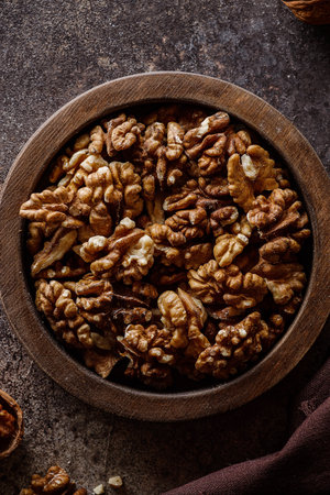 organic raw walnuts in a wooden bowl superfood, vegetarian. High quality photoの写真素材