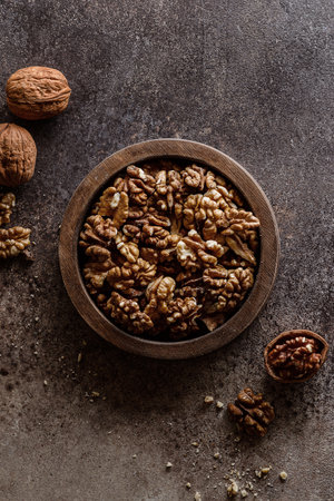 organic raw walnuts in a wooden bowl superfood, vegetarian. High quality photoの写真素材