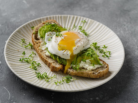 Bruschetta with avocado and poached eggの写真素材