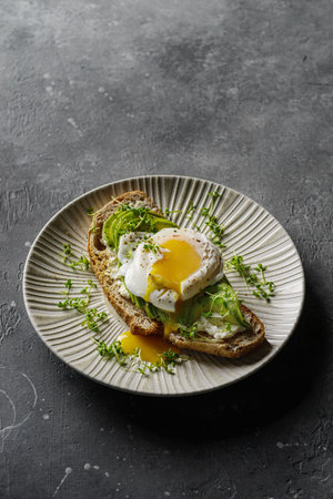 Bruschetta with avocado and poached eggの写真素材