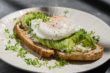 Bruschetta with avocado and poached egg, with cottage cheese, decorated with microgreens