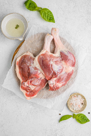 various parts of raw chicken on a light background. High quality photoの写真素材
