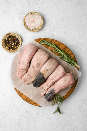 raw pork pieces on a light background.の写真素材