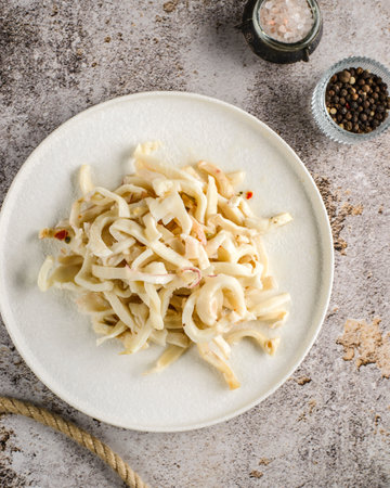 marinated squid salad on a white plate. High quality photoの写真素材
