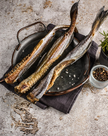 dried smoked fish on the table. High quality photo