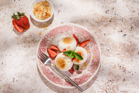 cottage cheese cheesecakes with strawberries and almondの写真素材