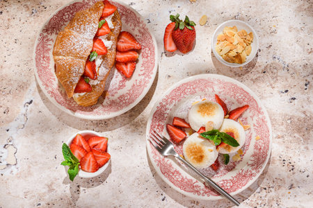cottage cheese cheesecakes with strawberries, croissant and porridge with strawberries. breakfast in the restaurantの写真素材