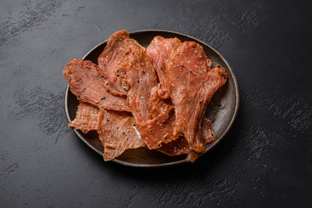 chicken dried chips on a black backgroundの写真素材