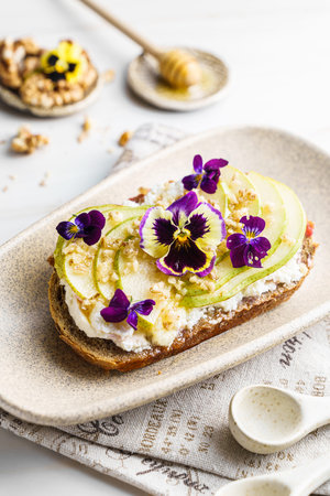 bruschetta with cottage cheese, pear, walnut and honeyの写真素材