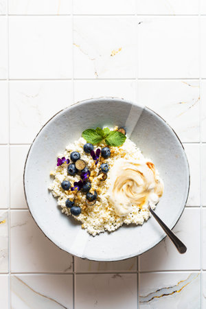 cottage cheese with blueberries and honey. High quality photo