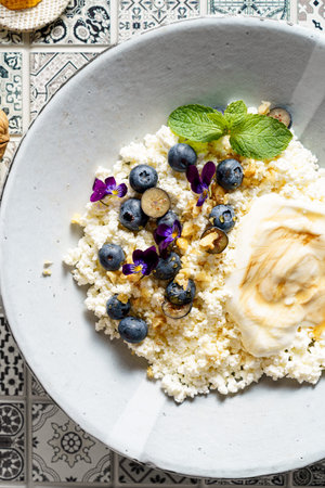 cottage cheese with blueberries and honey. High quality photo