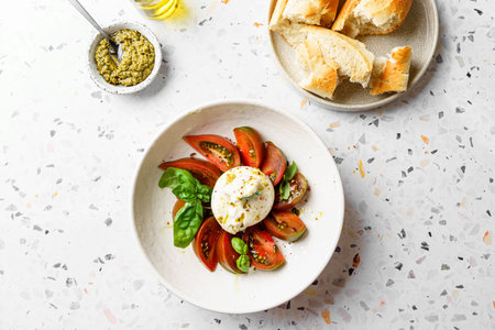 burrata with tomatoes, basil and pesto. High quality photoの写真素材