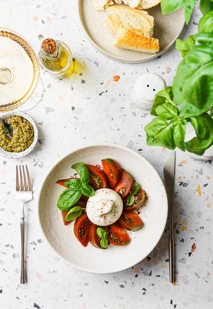 burrata with tomatoes, basil and pesto. High quality photoの写真素材