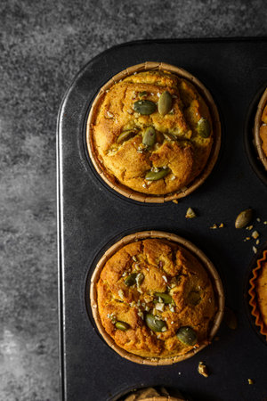 pumpkin muffins on a dark backgroundの写真素材