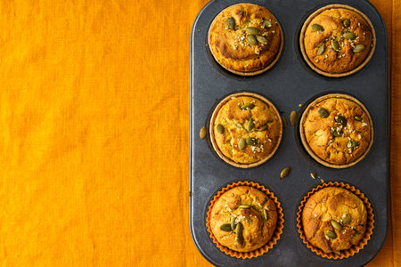 pumpkin muffins on an orange tablecloth