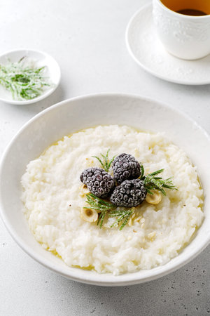 rice porridge with blackberries and honey. High quality photo