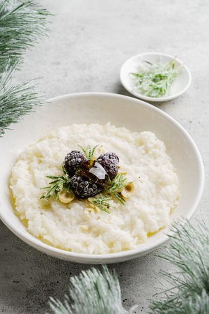 rice porridge with blackberries and honey. High quality photo