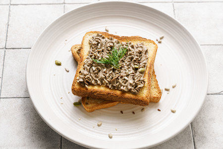 toast with chicken pate garnished with rosemary and seeds. High quality photoの写真素材
