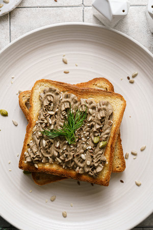 toast with chicken pate garnished with seeds. High quality photoの写真素材