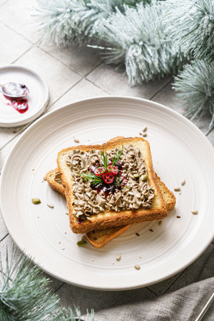 toast with chicken pate and cranberries on a grey background. High quality photoの写真素材