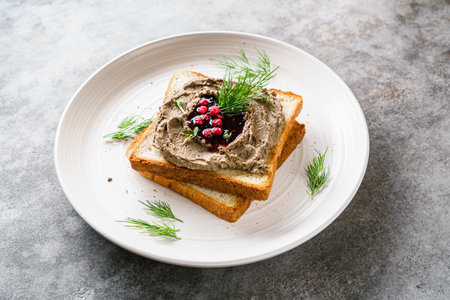 toast with chicken pate and lingonberry jam. High quality photoの写真素材