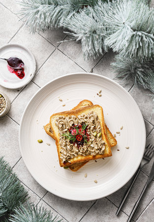 toast with chicken pate and cranberries on a grey background. High quality photoの写真素材
