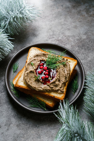 toast with chicken pate and lingonberry jam.の写真素材
