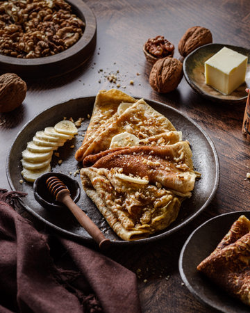 wholemeal crepes with honey, walnuts and bananas. High quality photoの写真素材