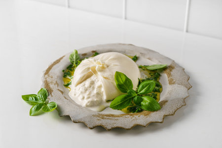 buratta with basil and olive oil. High quality photo
