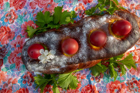 greek easter cake with colored eggsの写真素材
