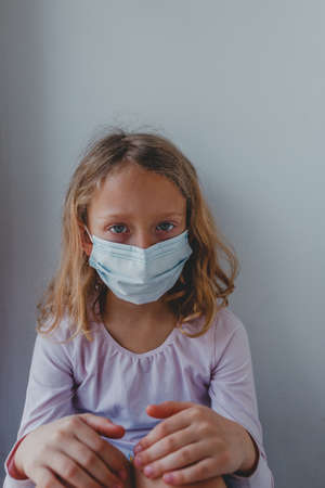 alert bed blond child closed  coronavirus coronovirus covid19 disease epidemic european face girl home hospital icons kid lockdown look mask medical one pandemic patient pneumonia portの写真素材