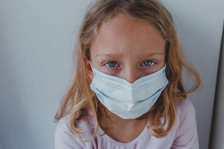 alert bed blond child closed coronavirus coronovirus covid19 disease epidemic european face girl home hospital icons kid lockdown look mask medical one pandemic patient pneumonia portの写真素材