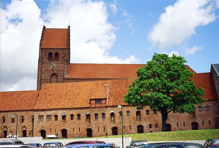 Landscape with church in Denmark and treeの写真素材