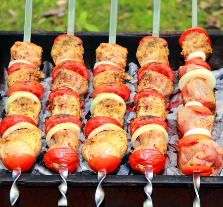 Image with fried meat, tomato and onionの写真素材