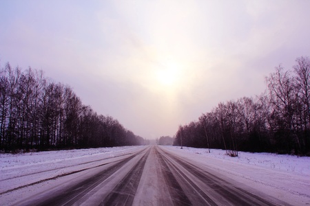 Image of winter road and cloudy skyの写真素材