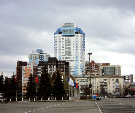 Landscape with white modern building with blue roofの写真素材