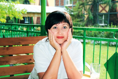 Image of smiling thinking woman on natureの写真素材