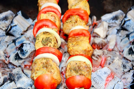 Image with fried meat, tomato and onionの写真素材