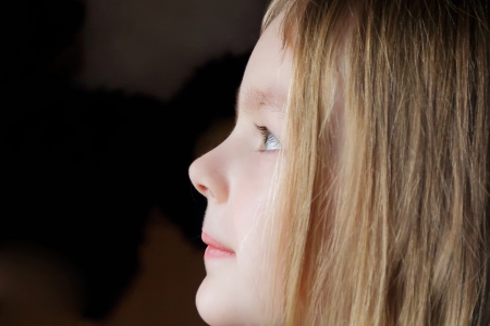 Portrait of girl's profile with blue eyesの写真素材