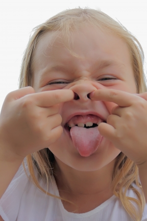 Portrait of girl with smile and makes facesの写真素材