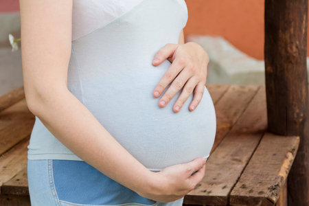 Image of pregnant woman in blue clothes