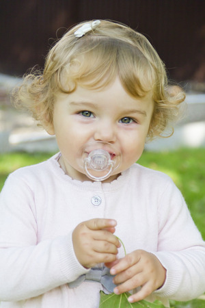 Image of cute baby girl suckle nippleの写真素材